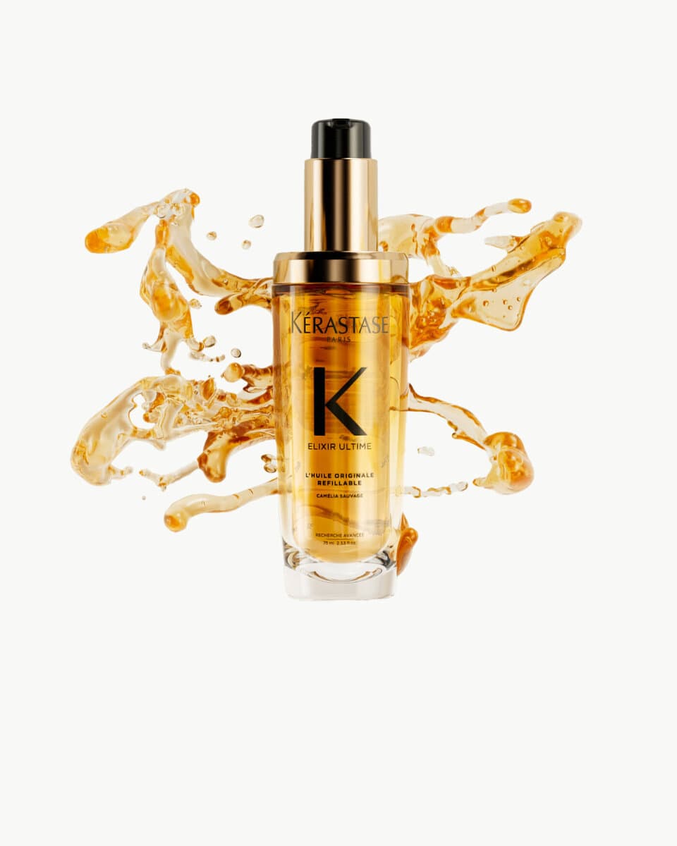Kérastase Elixir Ultime hair oil with a splash of golden oil